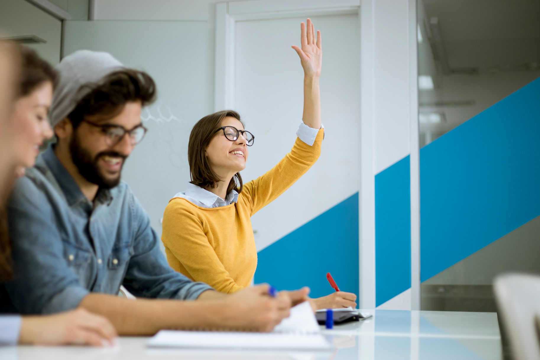 Student Raising Hands to Answer the Question during the Workshop